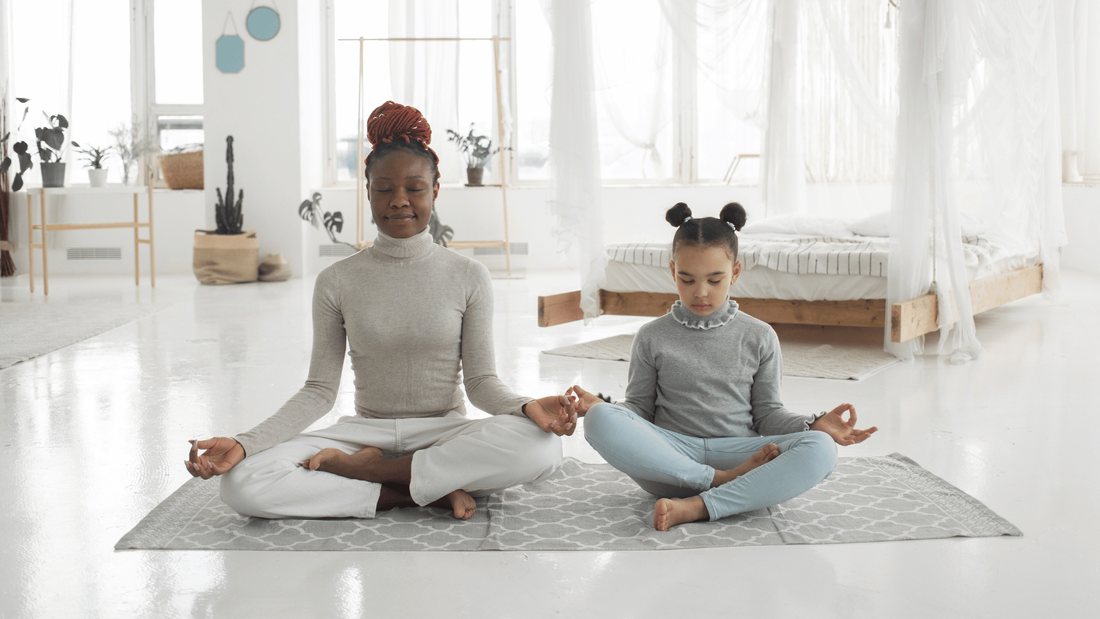 Mother and daughter meditating